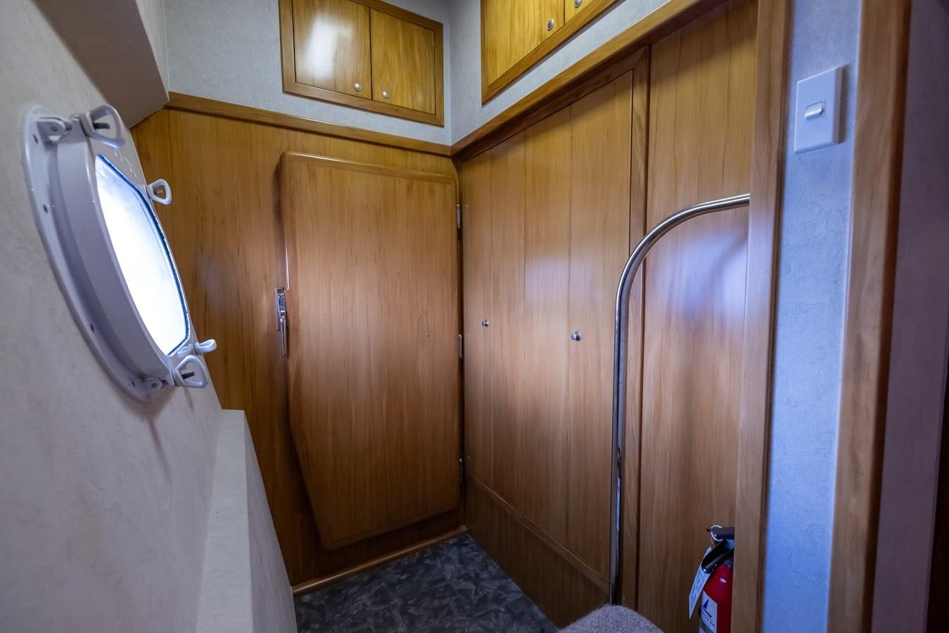 a bathroom with wooden cabinets aboard WHITE LIGHTNING Yacht for Sale