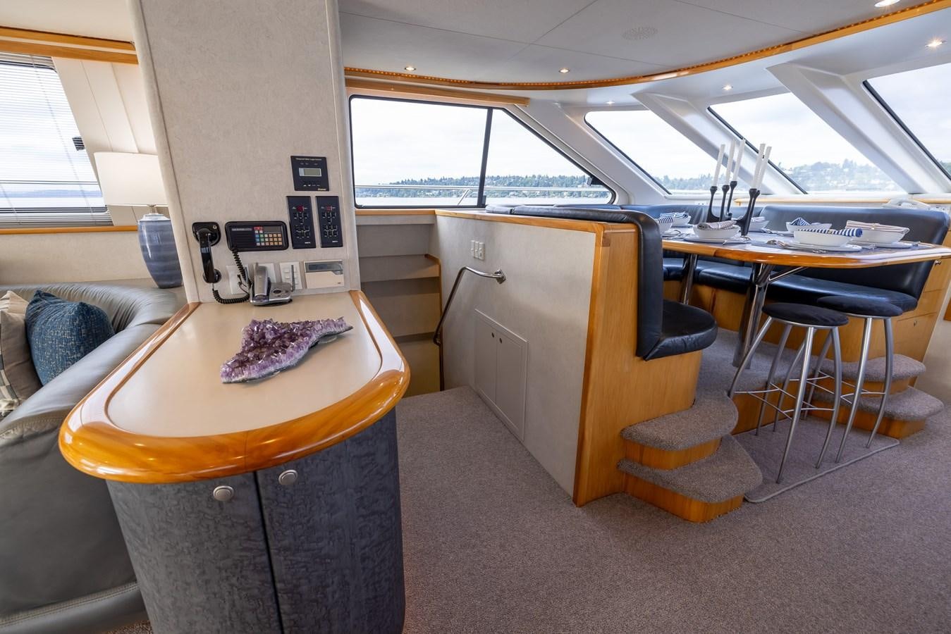 a room with a table and chairs aboard WHITE LIGHTNING Yacht for Sale