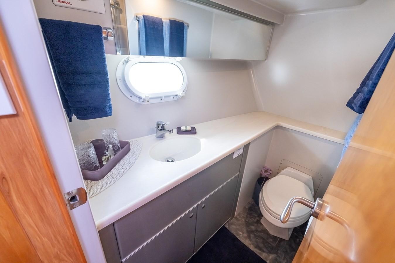a bathroom with a sink and a toilet aboard WHITE LIGHTNING Yacht for Sale