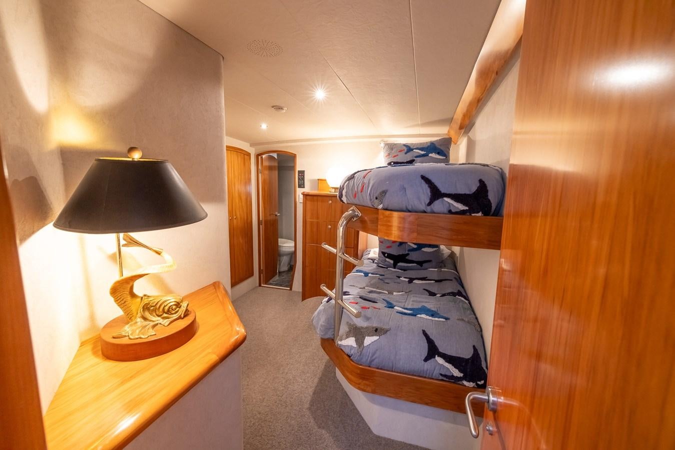 a chair with a blue blanket on it aboard WHITE LIGHTNING Yacht for Sale