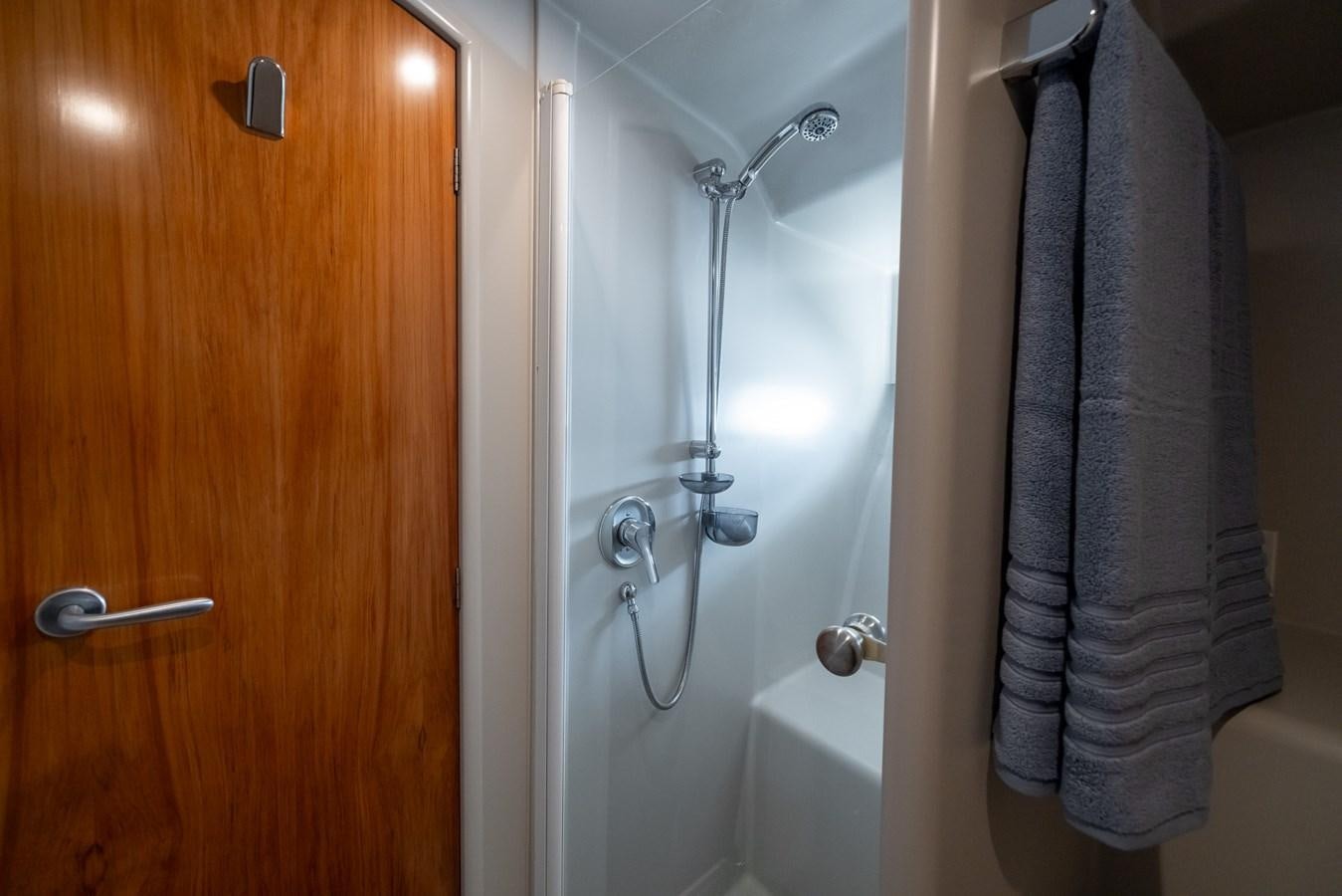 a bathroom with a towel on the wall aboard WHITE LIGHTNING Yacht for Sale