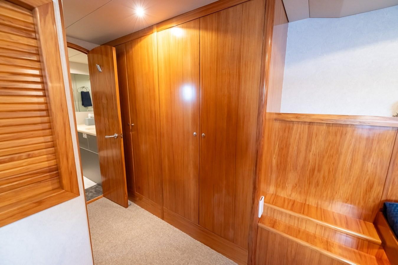 a room with wooden cabinets aboard WHITE LIGHTNING Yacht for Sale