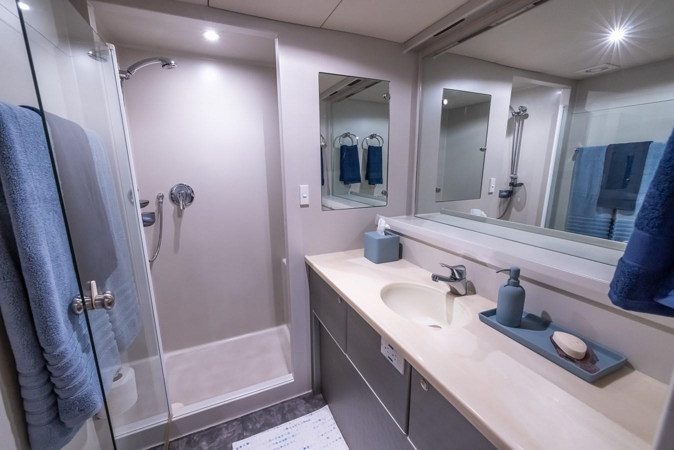a bathroom with a sink and a mirror aboard WHITE LIGHTNING Yacht for Sale