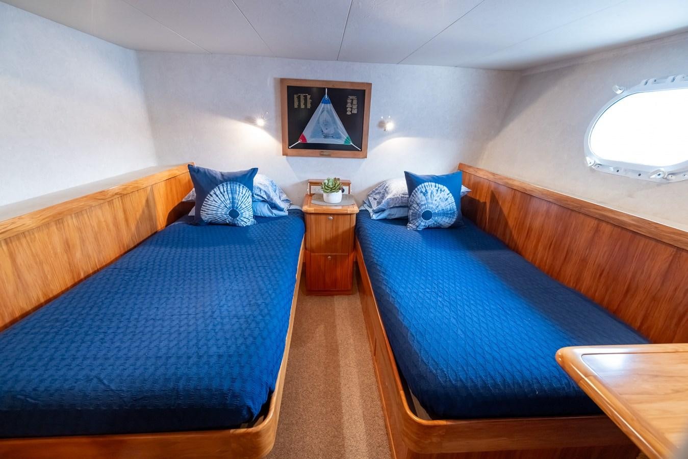 a couple of beds in a room aboard WHITE LIGHTNING Yacht for Sale