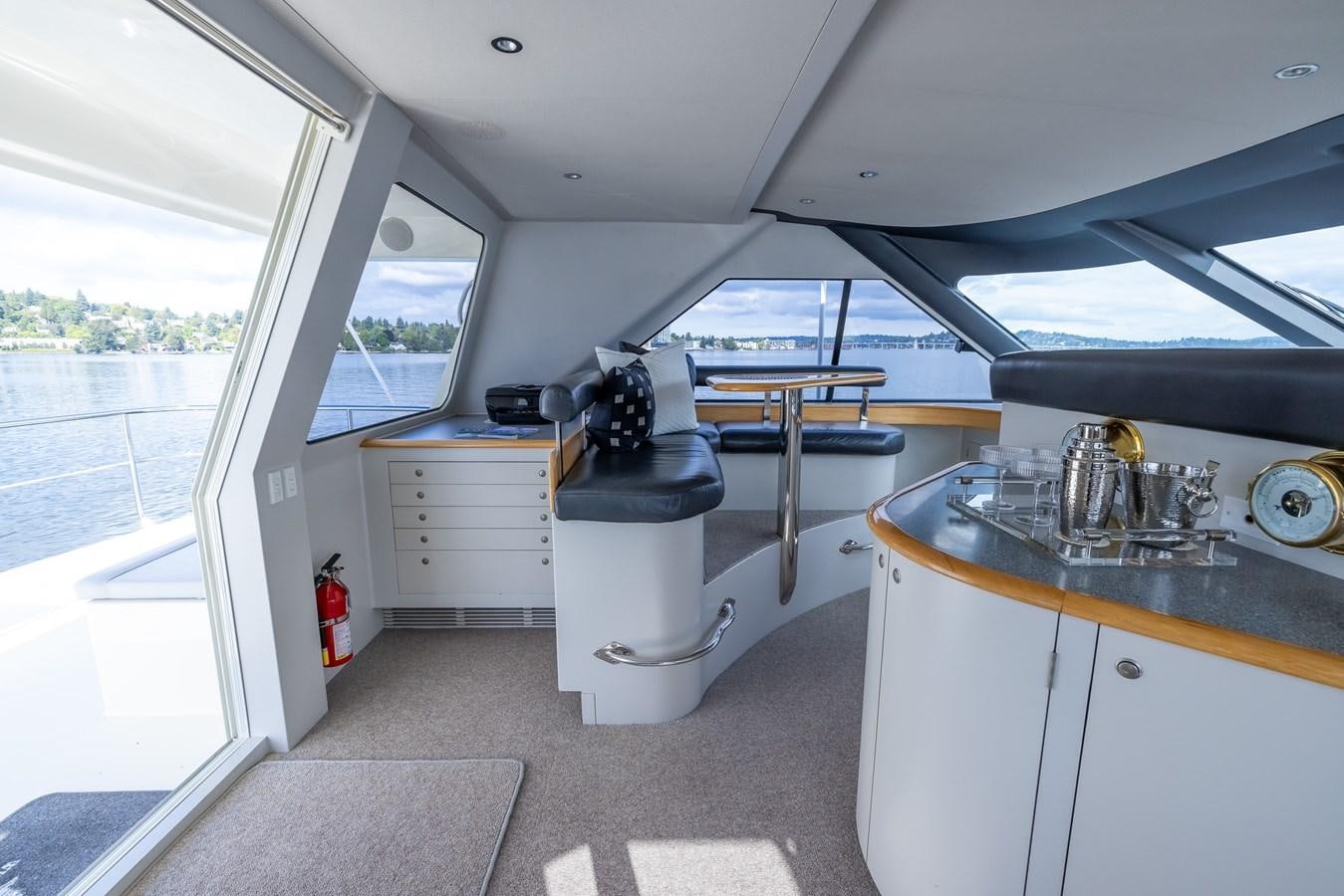 a small kitchen with a large window aboard WHITE LIGHTNING Yacht for Sale