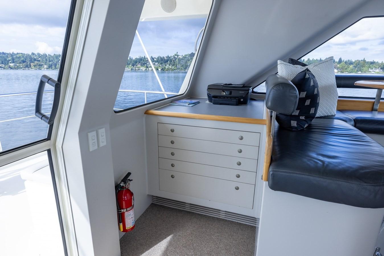 a car with a desk and a computer on it aboard WHITE LIGHTNING Yacht for Sale