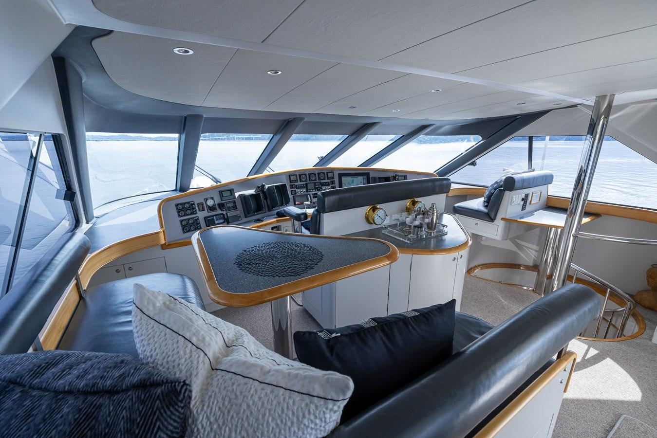 a room with a piano and a seat aboard WHITE LIGHTNING Yacht for Sale