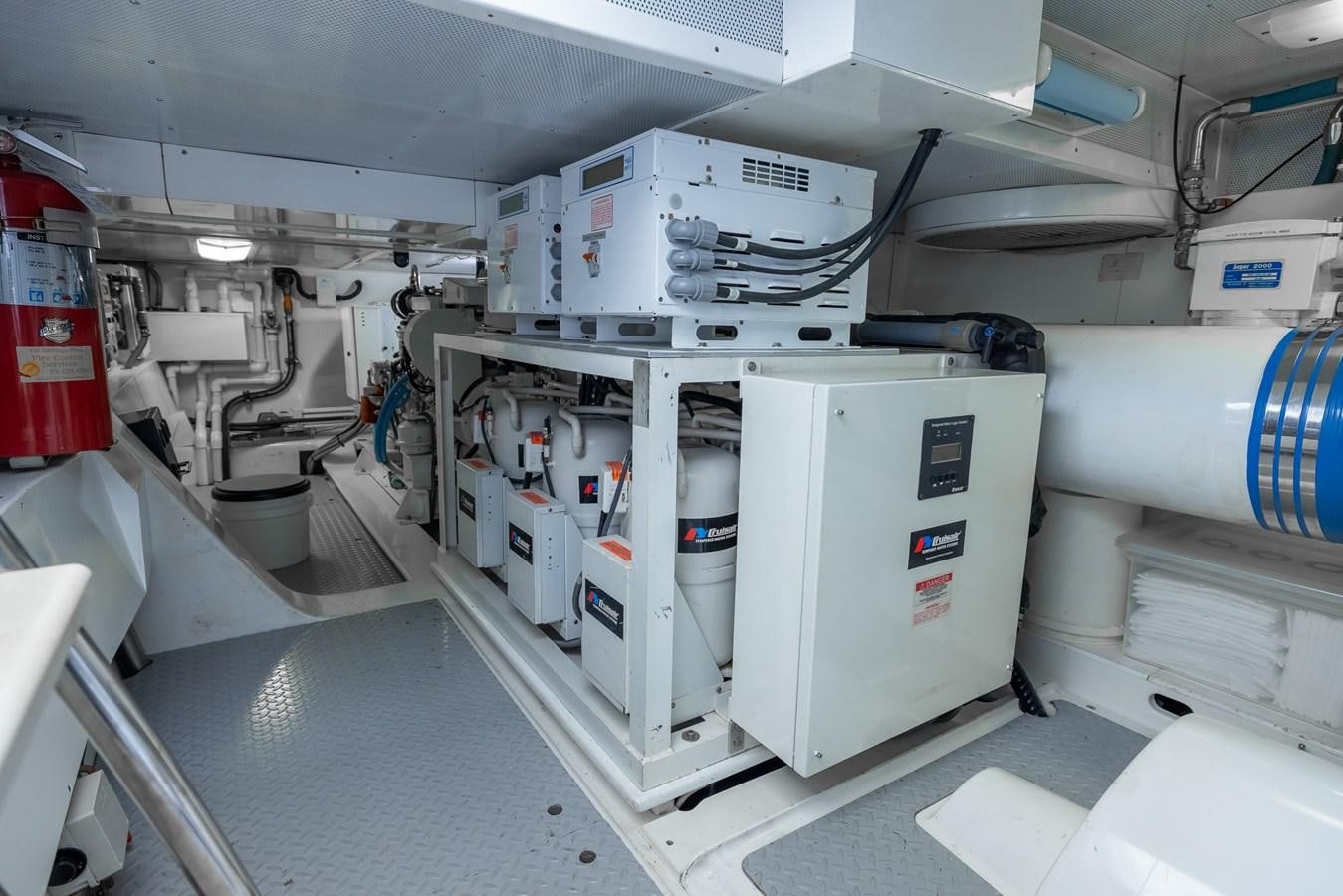 a large white machine in a room aboard WHITE LIGHTNING Yacht for Sale