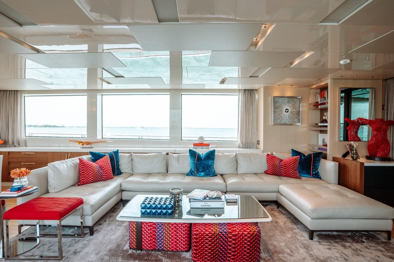 a living room with a couch and a coffee table aboard FIFTY SHADES Yacht for Sale