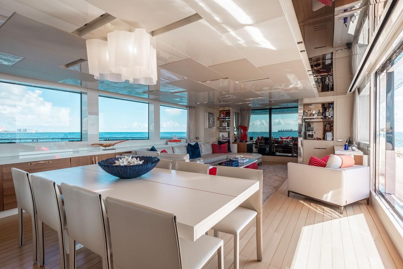 a room with a table and chairs aboard FIFTY SHADES Yacht for Sale