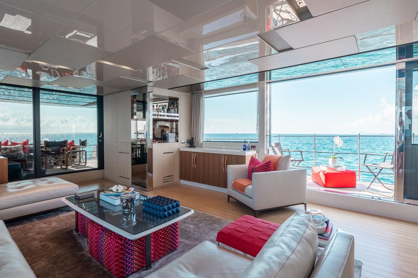a living room with a large window aboard FIFTY SHADES Yacht for Sale