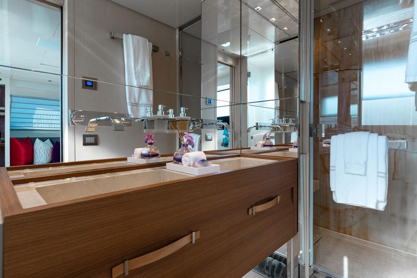 a bathroom with a glass shower aboard FIFTY SHADES Yacht for Sale