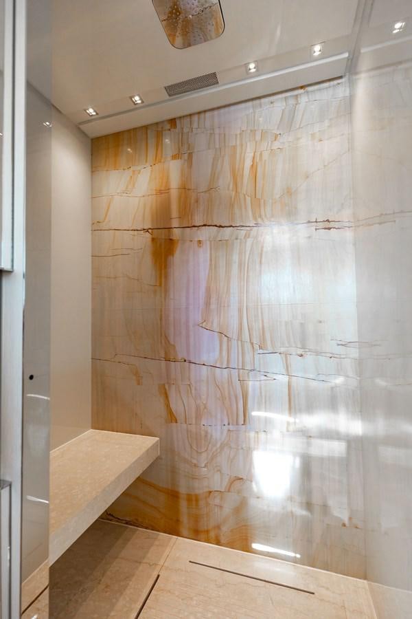 a shower with a tile wall aboard FIFTY SHADES Yacht for Sale