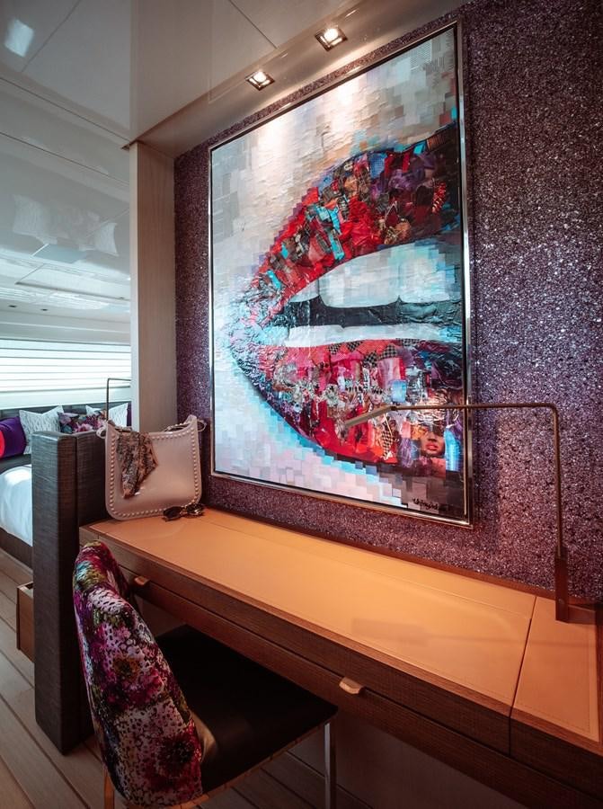 a room with a painting on the wall aboard FIFTY SHADES Yacht for Sale
