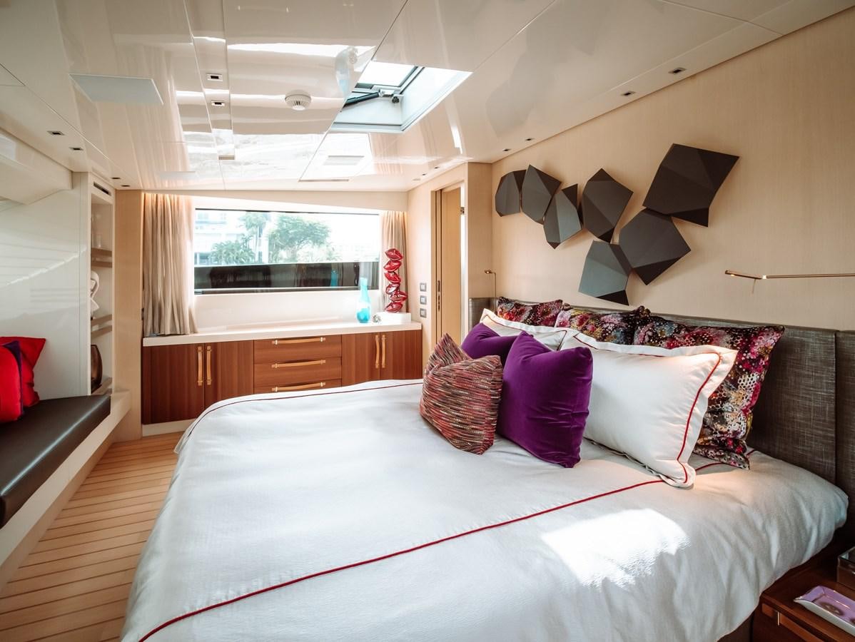 a bedroom with a large bed aboard FIFTY SHADES Yacht for Sale