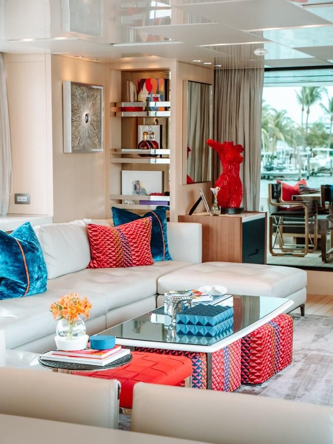 a living room with a white couch and a coffee table aboard FIFTY SHADES Yacht for Sale