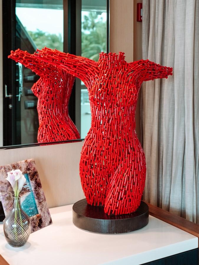 a red vase with a fish aboard FIFTY SHADES Yacht for Sale