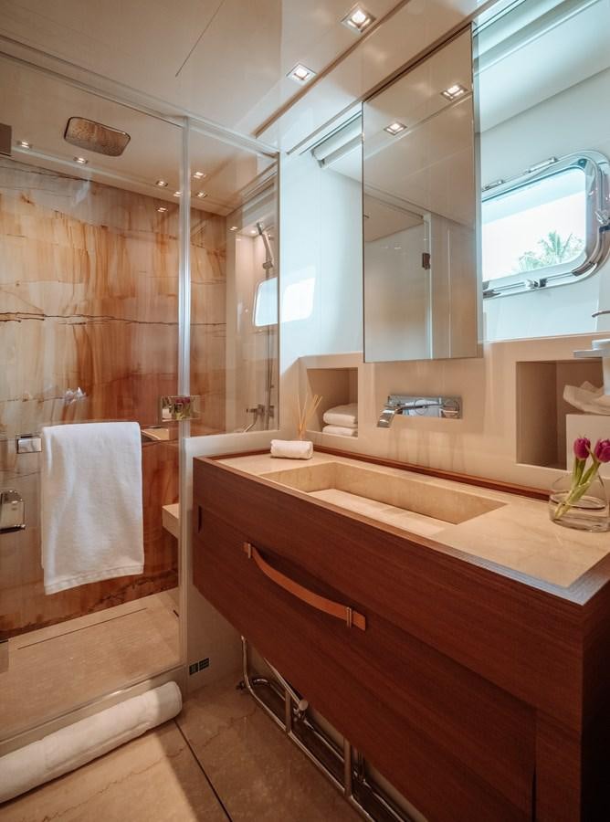 a bathroom with a large mirror aboard FIFTY SHADES Yacht for Sale