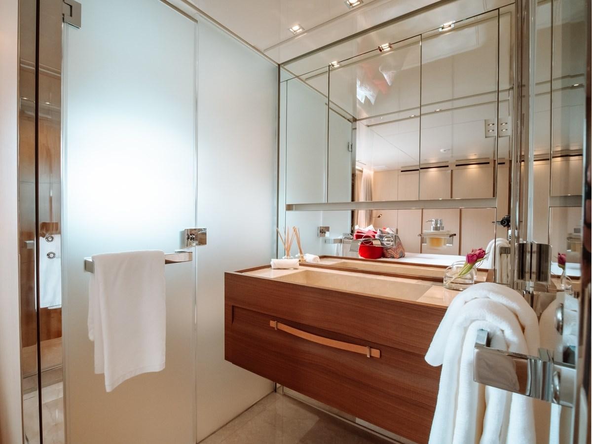 a bathroom with a sink and a mirror aboard FIFTY SHADES Yacht for Sale