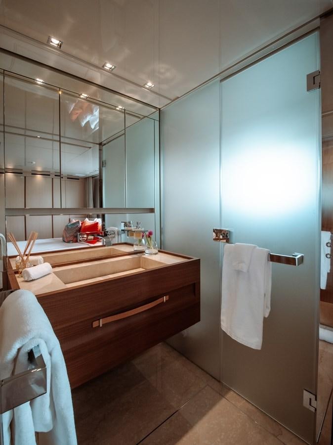 a bathroom with a large mirror aboard FIFTY SHADES Yacht for Sale