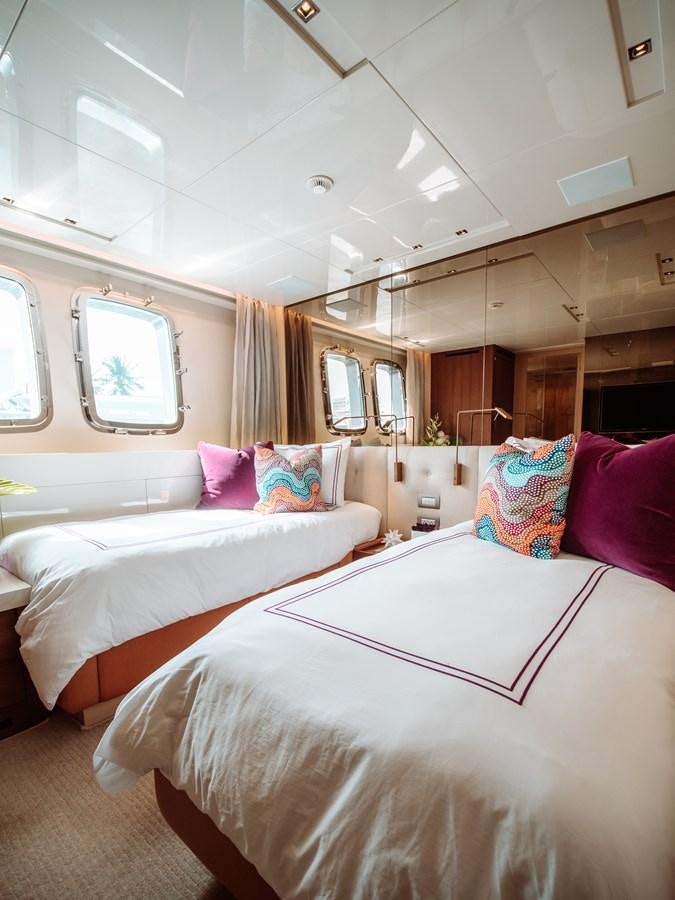 a couple of beds in a room aboard FIFTY SHADES Yacht for Sale