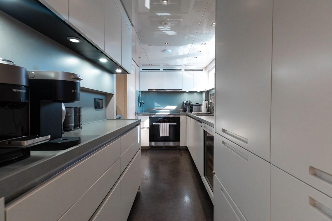 a kitchen with stainless steel appliances aboard FIFTY SHADES Yacht for Sale