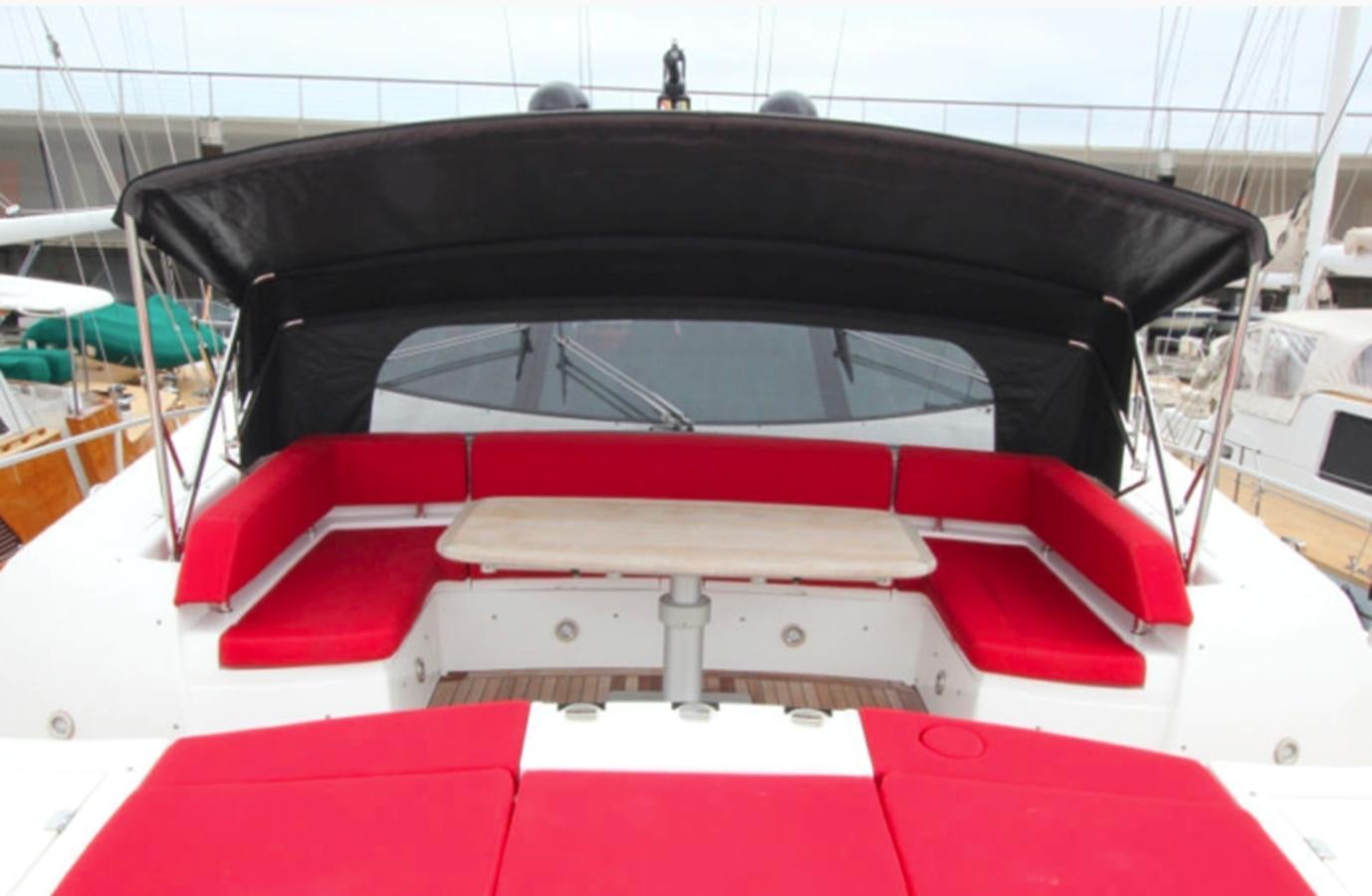 the back of a red and white car aboard UM7 Yacht for Sale