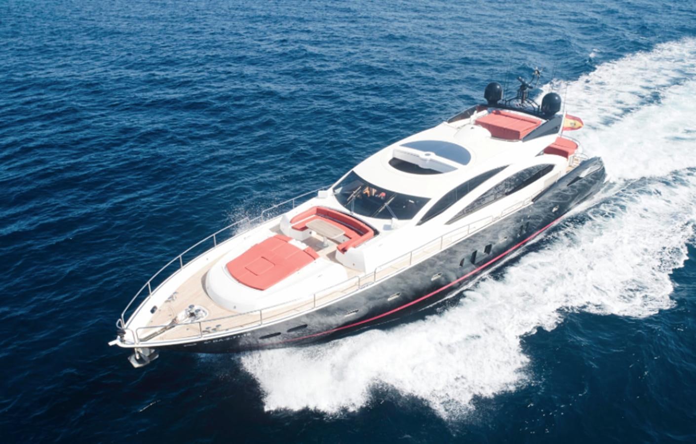 a white and red boat in the water aboard UM7 Yacht for Sale