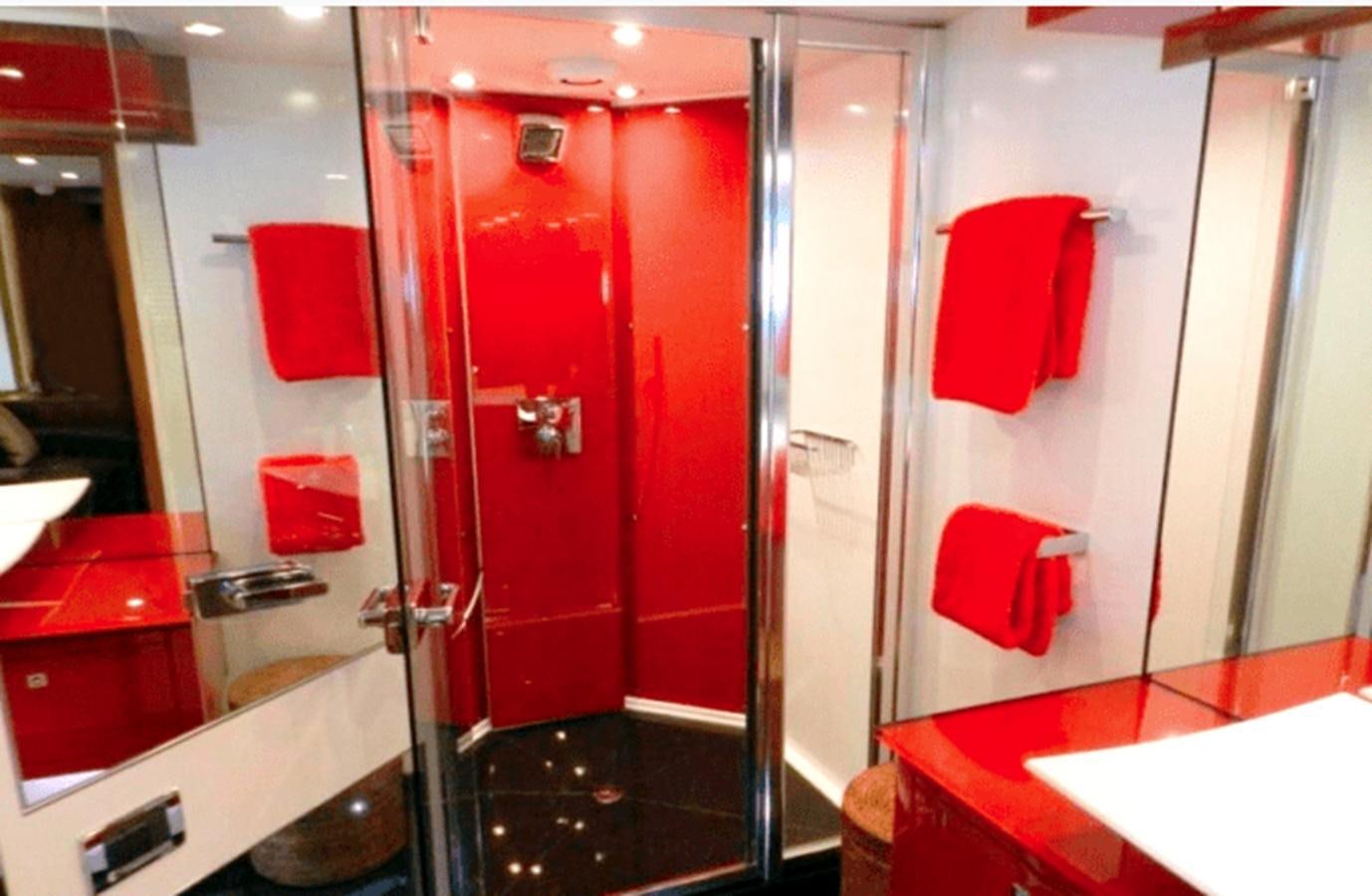 a bathroom with red doors aboard UM7 Yacht for Sale