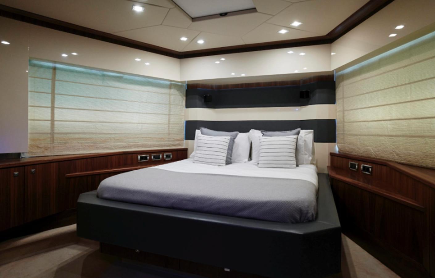 a room with a bed and a window aboard UM7 Yacht for Sale