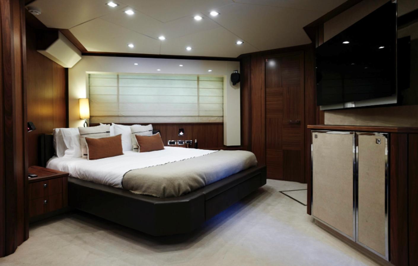 a large bed in a room aboard UM7 Yacht for Sale