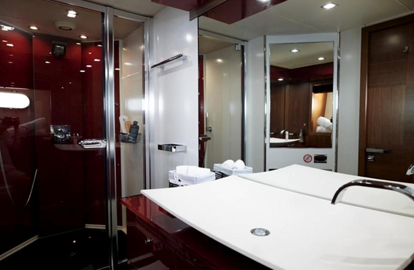 a bathroom with a large mirror aboard UM7 Yacht for Sale