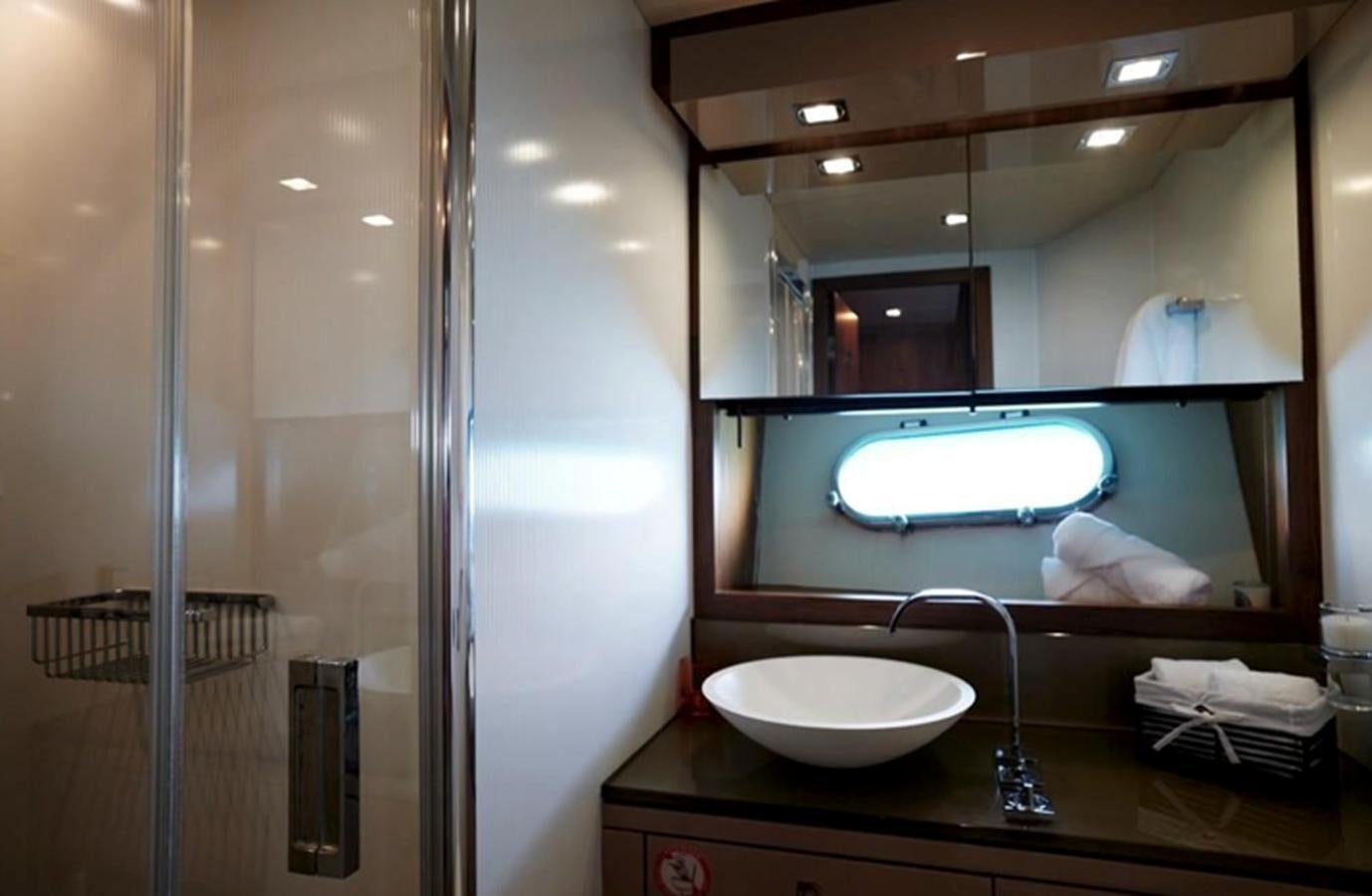 a bathroom with a large mirror aboard UM7 Yacht for Sale