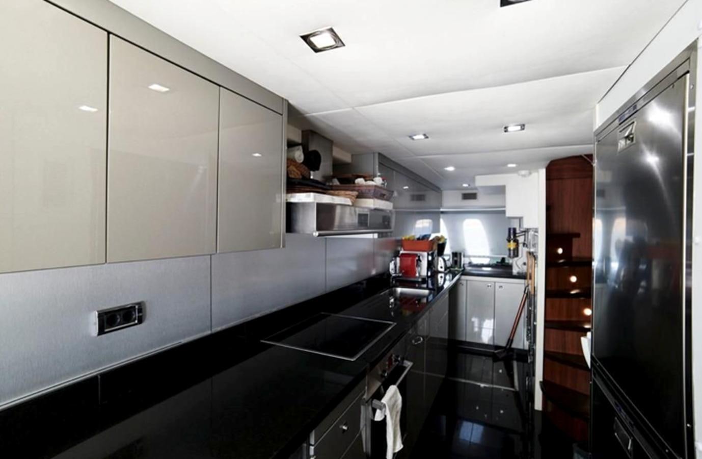 a kitchen with a large island aboard UM7 Yacht for Sale