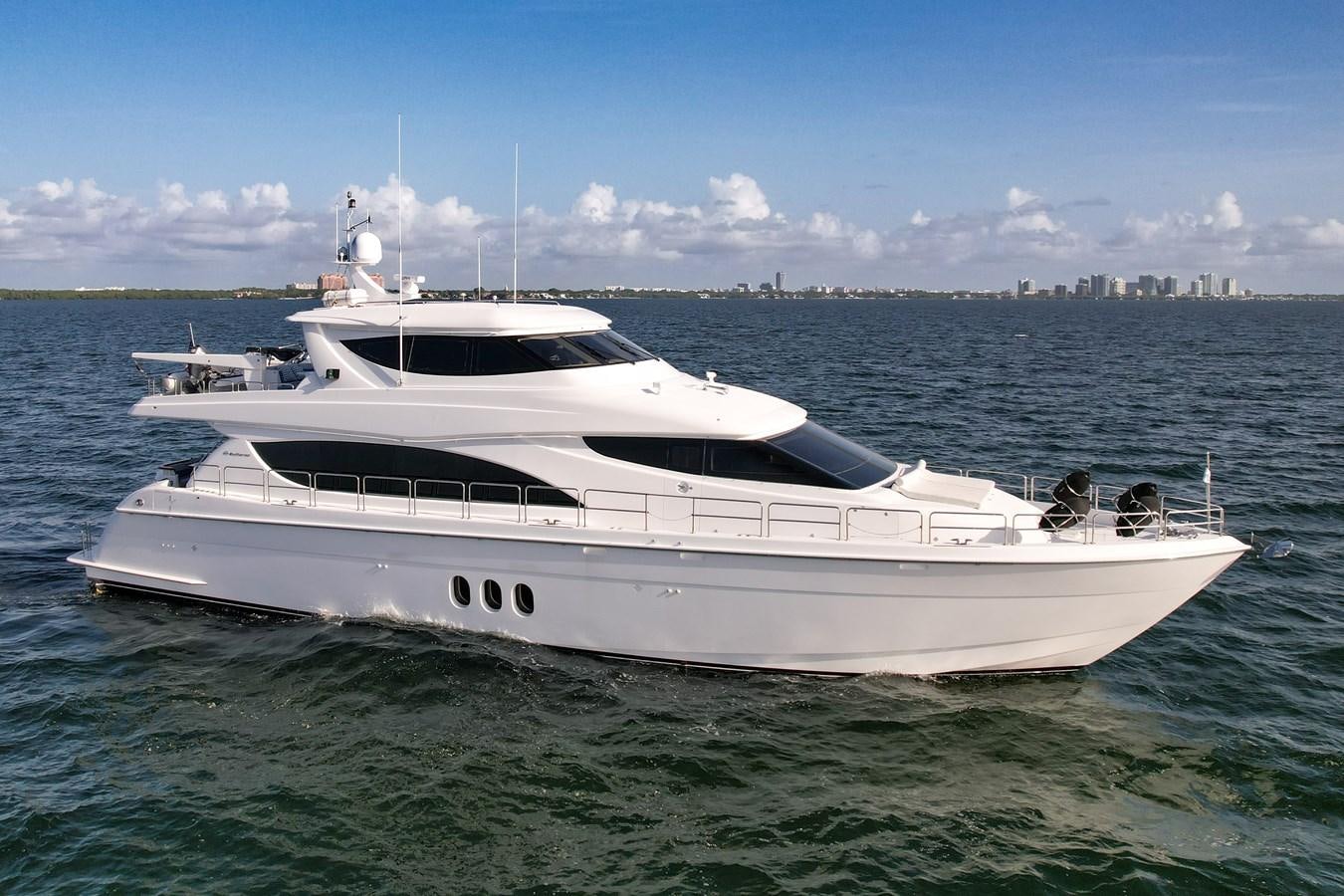 a white yacht in the water aboard HATTERAS 80 MOTOR Yacht for Sale
