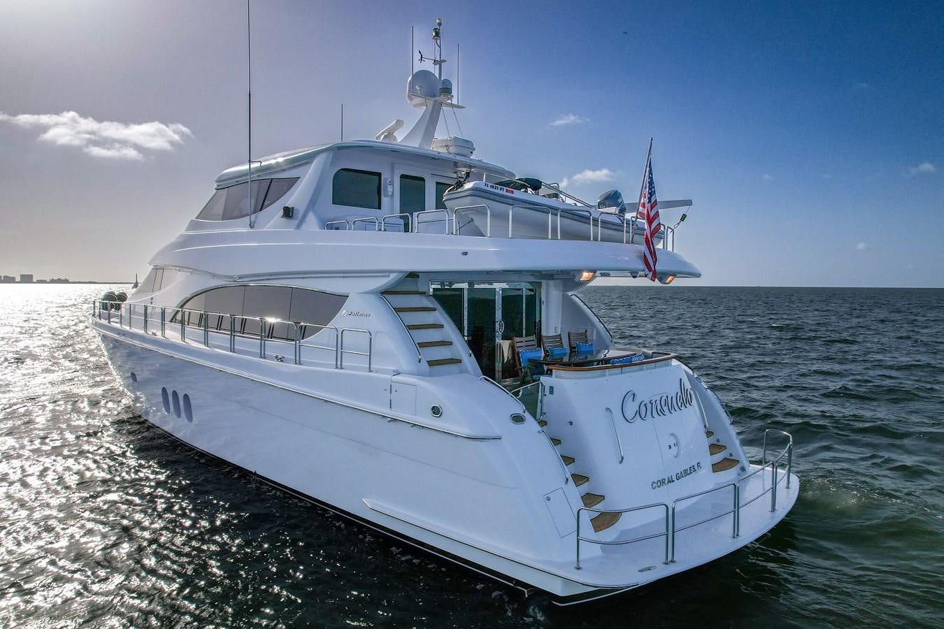 a boat on the water aboard HATTERAS 80 MOTOR Yacht for Sale