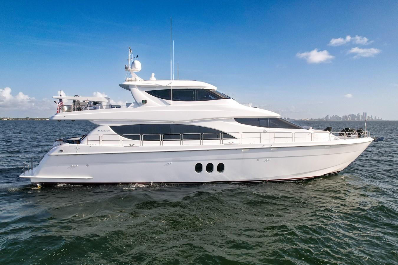 a white yacht in the water aboard HATTERAS 80 MOTOR Yacht for Sale