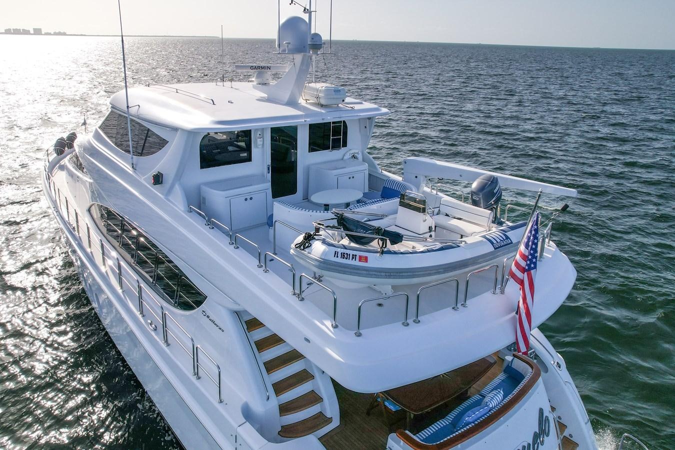 a boat on the water aboard HATTERAS 80 MOTOR Yacht for Sale