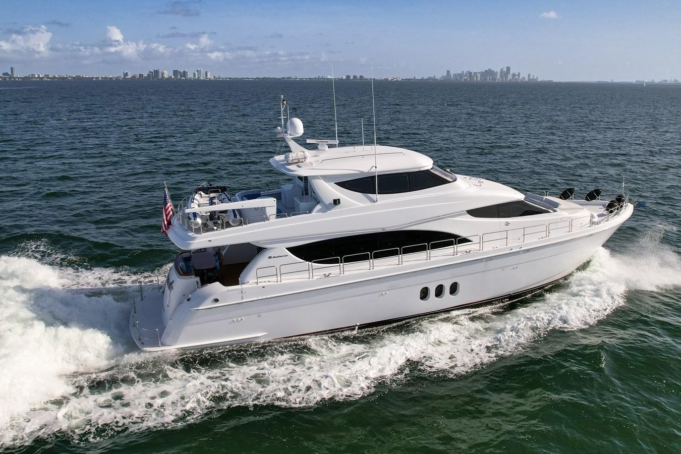 a boat on the water aboard HATTERAS 80 MOTOR Yacht for Sale
