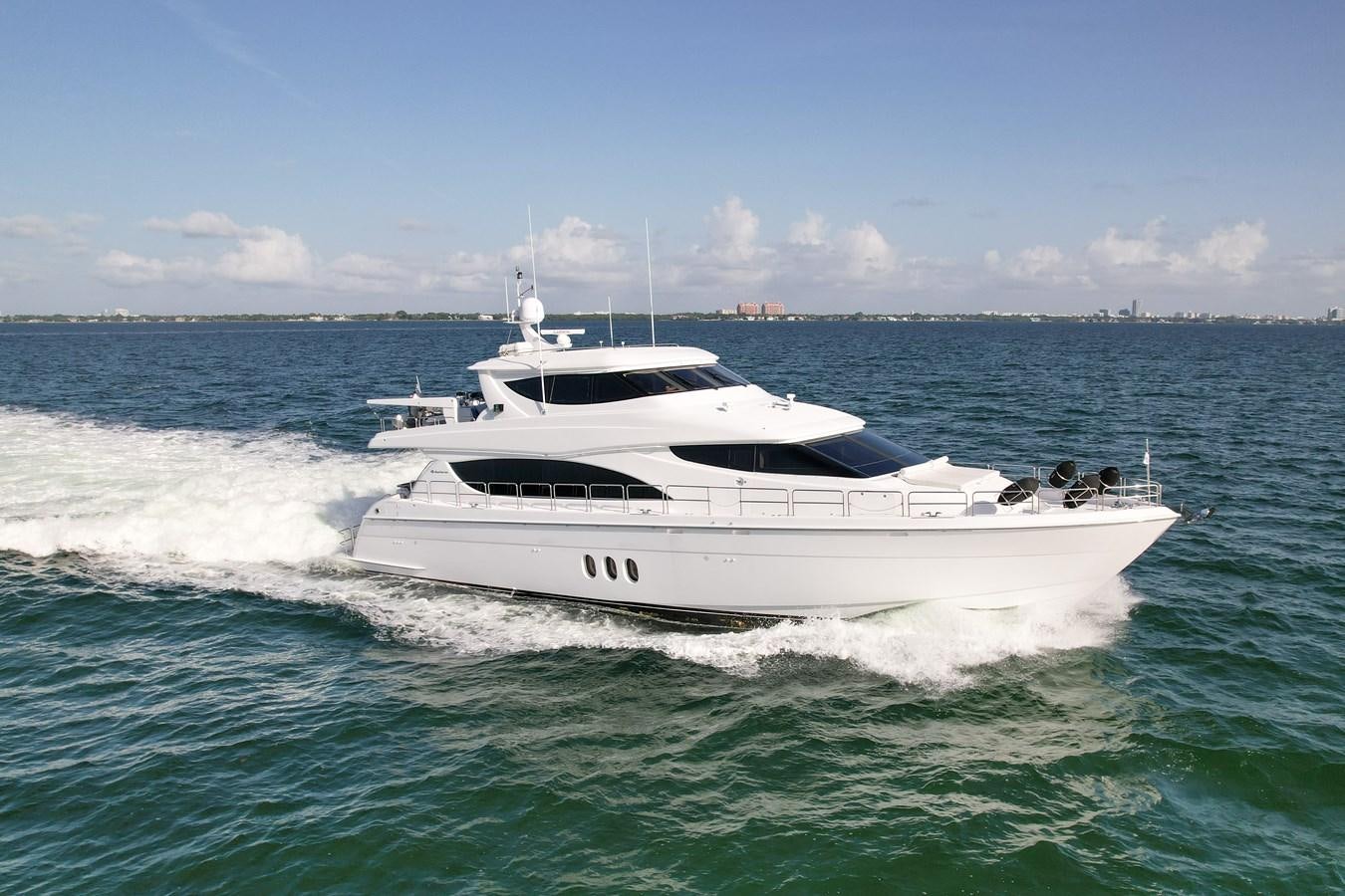 a white yacht in the water aboard HATTERAS 80 MOTOR Yacht for Sale