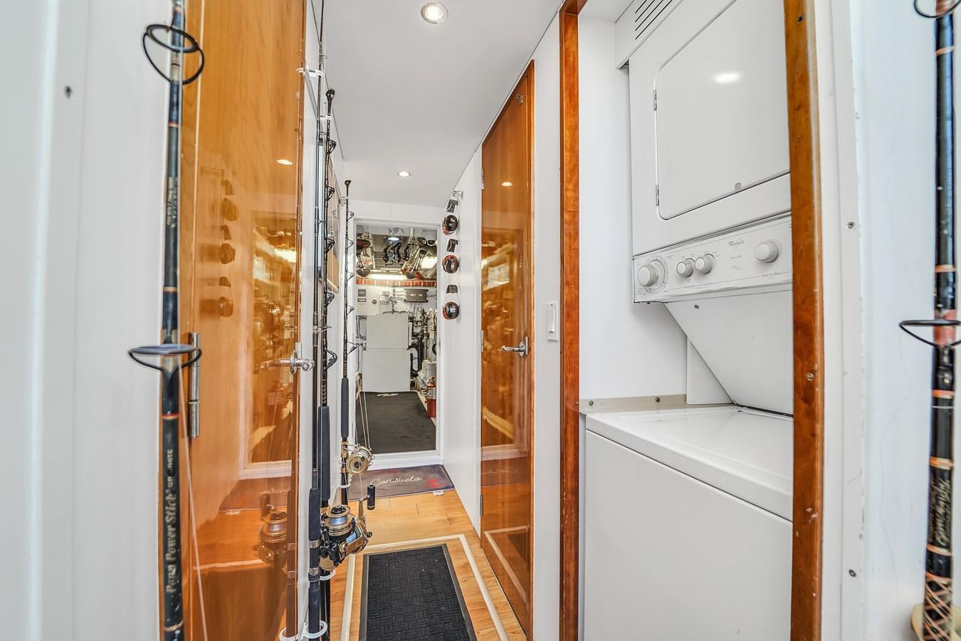 a room with white cabinets aboard HATTERAS 80 MOTOR Yacht for Sale