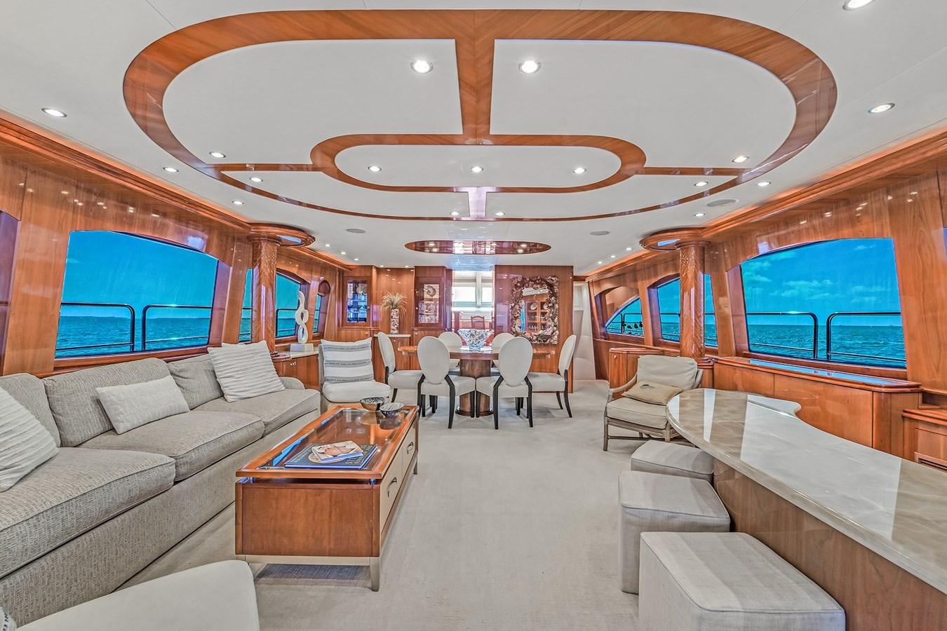 a living room with a large open window aboard HATTERAS 80 MOTOR Yacht for Sale