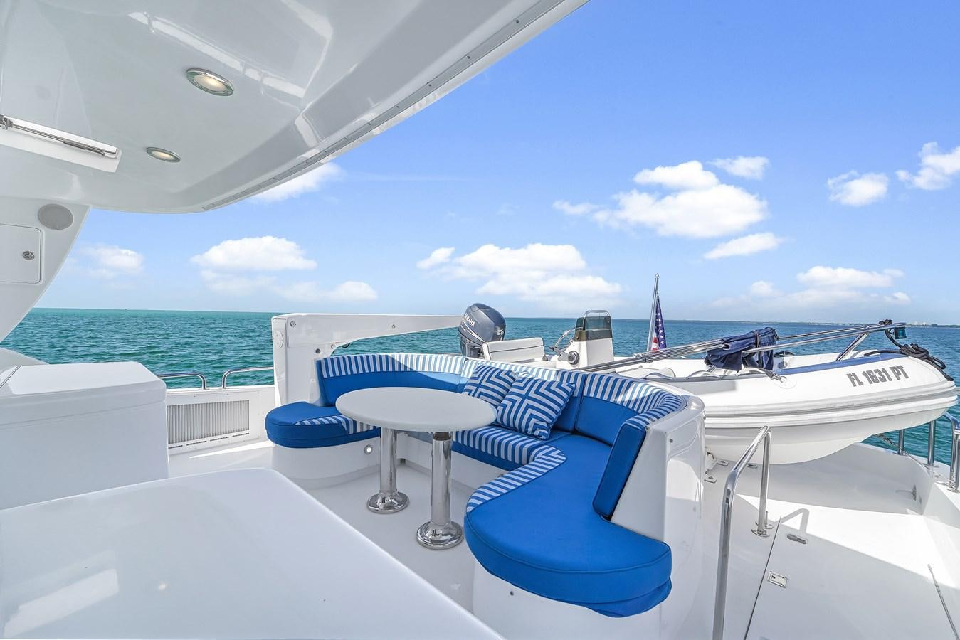 a boat on the water aboard HATTERAS 80 MOTOR Yacht for Sale