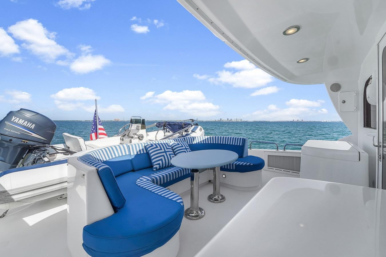 a boat on the water aboard HATTERAS 80 MOTOR Yacht for Sale