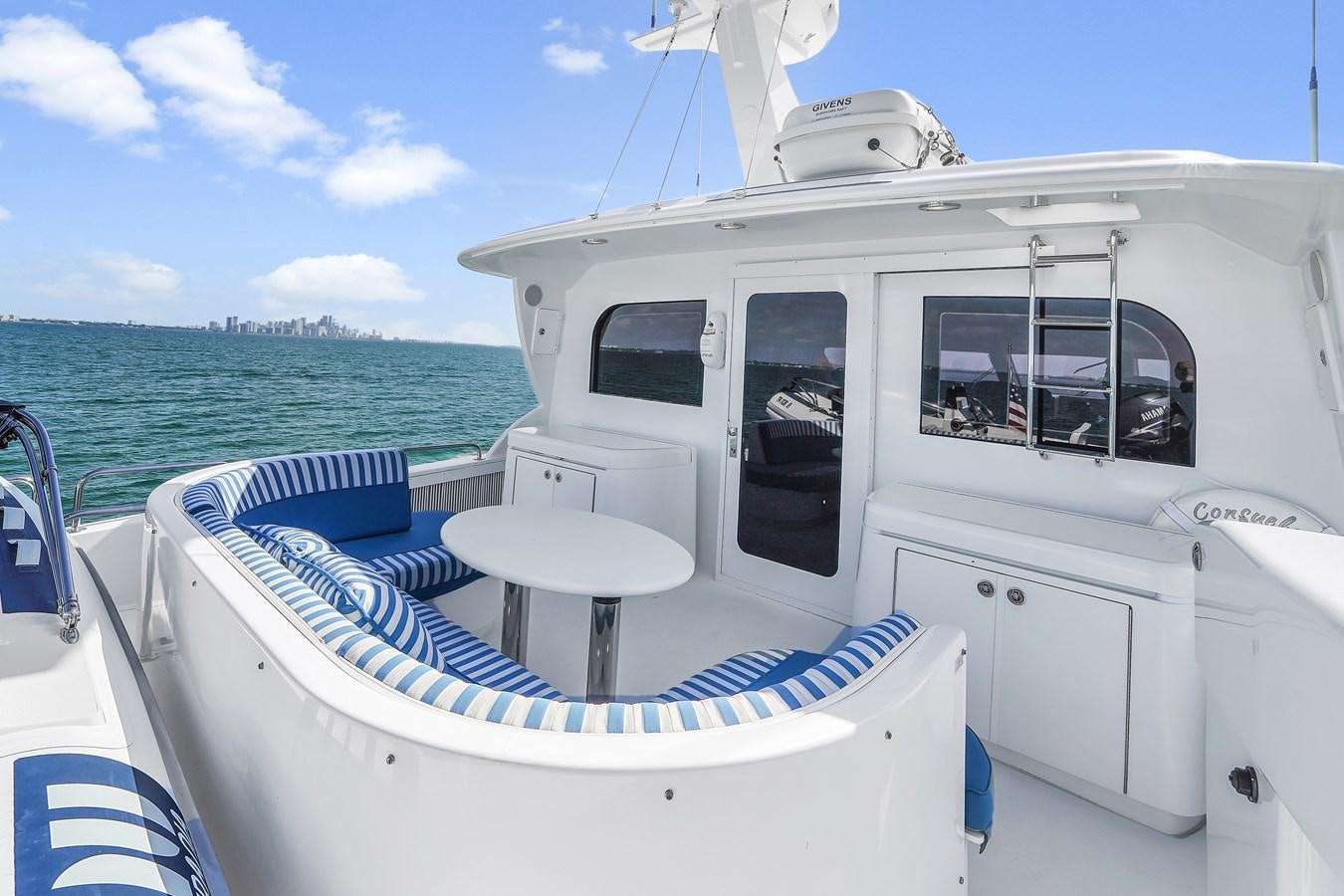 a boat on the water aboard HATTERAS 80 MOTOR Yacht for Sale