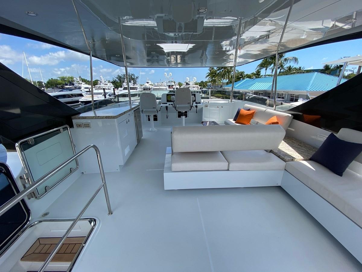 a large room with a couch and a pool aboard CLB 72 Yacht for Sale