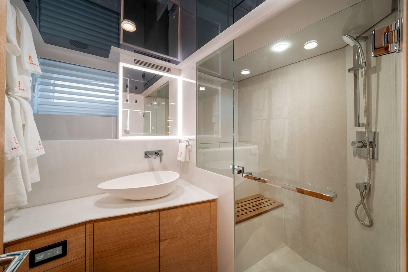 a bathroom with a sink and a shower aboard CLB 72 Yacht for Sale