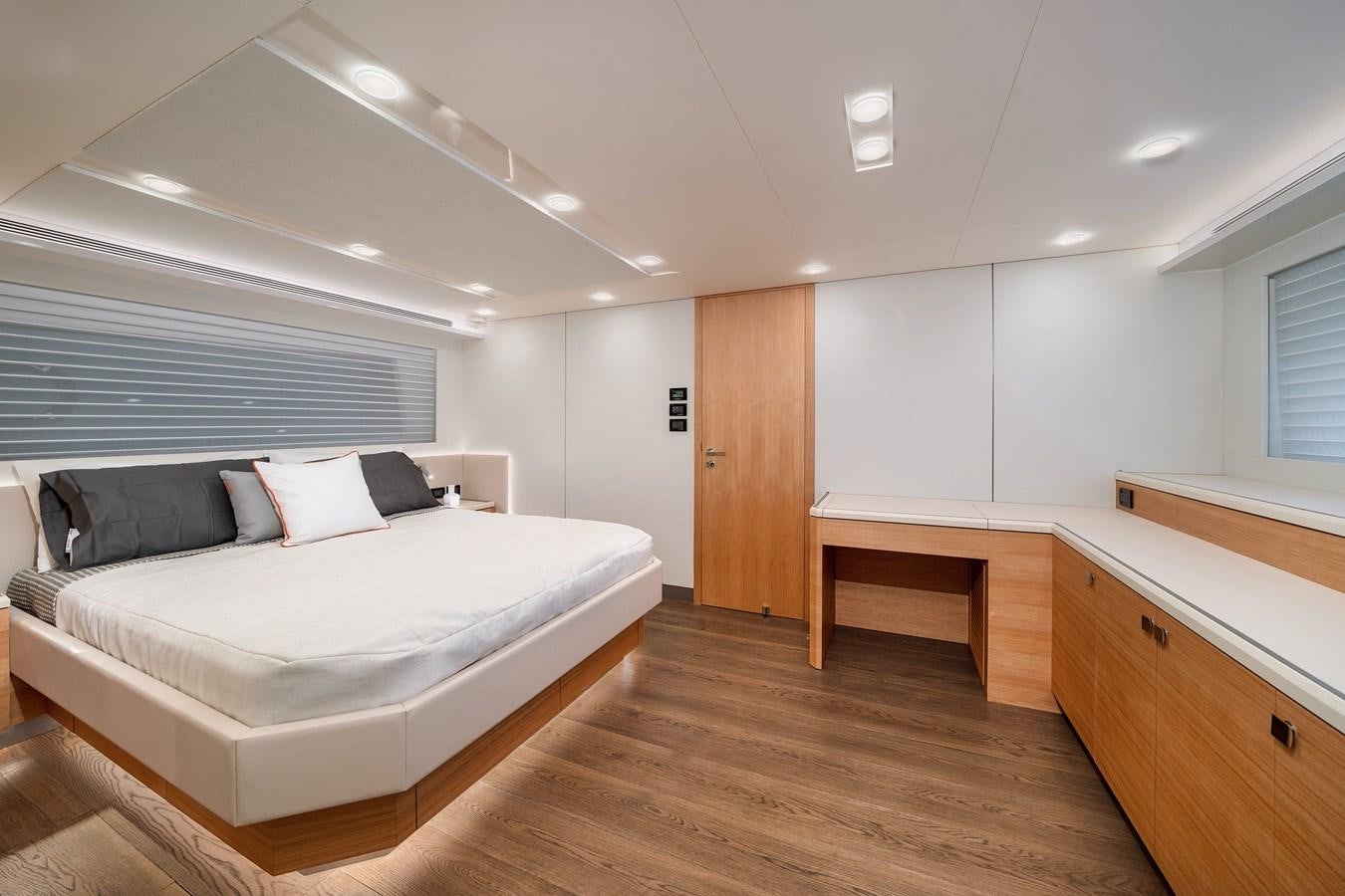a bedroom with a large bed aboard CLB 72 Yacht for Sale