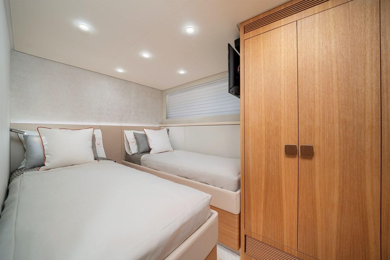 a room with a bed and a closet aboard CLB 72 Yacht for Sale