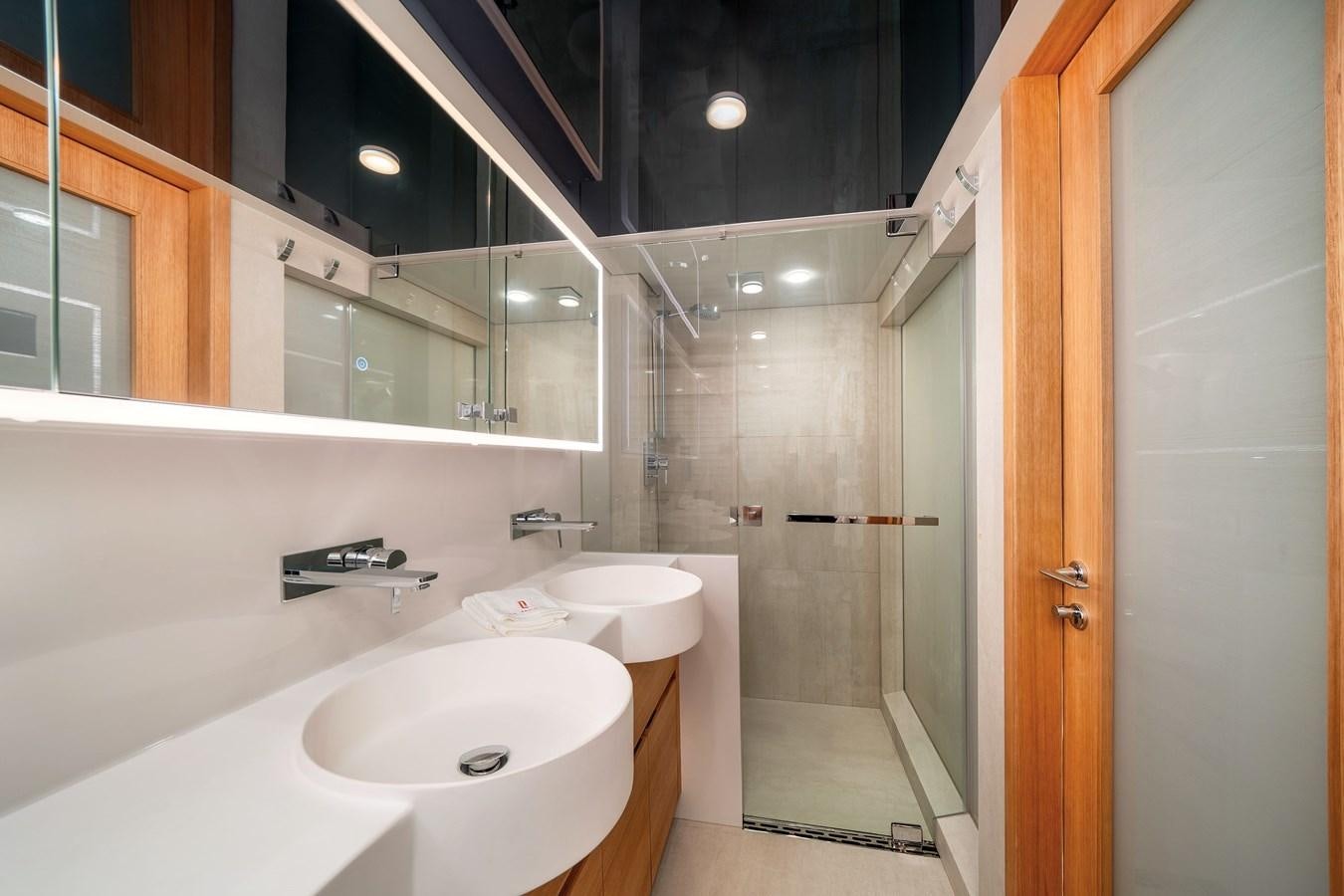a bathroom with a sink and a shower aboard CLB 72 Yacht for Sale